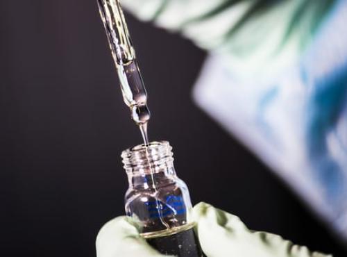 An image of a needle entering a phial representing health innovation. Image credit: CDC via Unsplash.