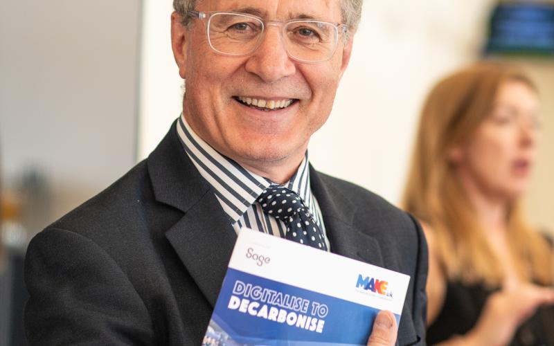 Mark Pawsey MP smiling with MakeUK report in his hands