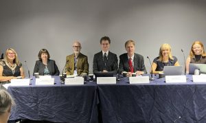 Panellists Robert McLaren, Sir Stephen Timms MP, Professor Nic Beech, Lucy McLeod, Petra Wilton, Joanne Howcroft- Scott, and Rhiannon Tuckett-Jones.